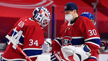 Apr 30, 2021; Montreal, Quebec, CAN; Montreal Canadiens goalie Jake Allen (34) and teammate goalie Cayden Primeau (30) Mandatory Credit: Eric Bolte-USA TODAY Sports