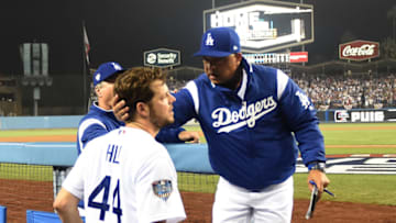 LOS ANGELES, CA - OCTOBER 27: Manager Dave Roberts #30 of the Los Angeles Dodgers talks with pitcher Rich Hill #44 after taking Hill out of the game in the sixth inning of Game Four of the 2018 World Series against the Boston Red Sox at Dodger Stadium on October 27, 2018 in Los Angeles, California. (Photo by Harry How/Getty Images)