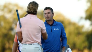 ST SIMONS ISLAND, GEORGIA - NOVEMBER 18: Charles Howell III of the United States shakes hands with Patrick Rodgers of the United States after making his putt on the 18th hole in the second playoff of the final round to win the RSM Classic at the Sea Island Golf Club Seaside Course on November 18, 2018 in St. Simons Island, Georgia. (Photo by Streeter Lecka/Getty Images)