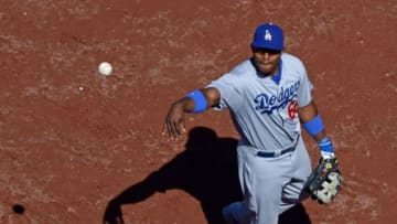 Aug 31, 2014; San Diego, CA, USA; Los Angeles Dodgers right fielder Yasiel Puig (66) tosses a ball into the stands after the fifth inning against the San Diego Padres at Petco Park. Mandatory Credit: Jake Roth-USA TODAY Sports