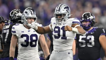Dec 3, 2022; Arlington, TX, USA; Kansas State Wildcats defensive end Brendan Mott (38) and defensive end Felix Anudike-Uzomah (91) during the game between the TCU Horned Frogs and the Kansas State Wildcats at AT&T Stadium. Mandatory Credit: Jerome Miron-USA TODAY Sports