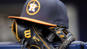 MILWAUKEE, WISCONSIN - APRIL 10: Jose Altuve #27 of Houston Astros rests his hat and glove in the dugout before the game against the Milwaukee Brewers at Miller Park on April 10, 2016 in Milwaukee, Wisconsin. (Photo by Dylan Buell/Getty Images)