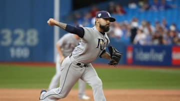 TORONTO, ON - AUGUST 11: Sergio Romo #54 of the Tampa Bay Rays delivers a pitch in the ninth inning during MLB game action against the Toronto Blue Jays at Rogers Centre on August 11, 2018 in Toronto, Canada. (Photo by Tom Szczerbowski/Getty Images)