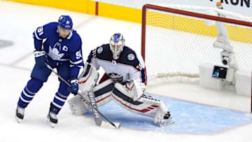 Joonas Korpisalo #70 of the Columbus Blue Jackets stops a shot as John Tavares #91 of the Toronto Maple Leafs. (Andre Ringuette/Freestyle Photo/Getty Images)