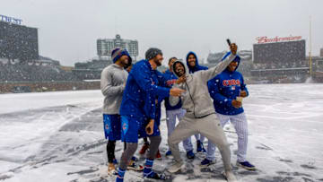 Kris Bryant, Carl Edwards Jr. and their Chicago Cubs teammates pose in the snow on Monday, April 9, 2018 at Wrigley Field in Chicago, Ill. The game was postponed to Tuesday because of the weather. (Brian Cassella/Chicago Tribune/TNS via Getty Images)