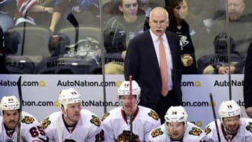 Nov 26, 2014; Denver, CO, USA; Chicago Blackhawks head coach Joel Quenneville calls out from his bench in the first period against the Colorado Avalanche at Pepsi Center. Mandatory Credit: Ron Chenoy-USA TODAY Sports