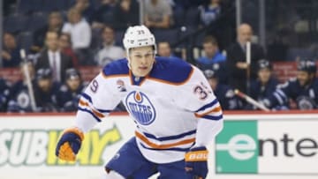 Sep 30, 2016; Winnipeg, Manitoba, CAN; Edmonton Oilers defenseman Jesse Puljujarvi (39) skates through the middle of the ice during a preseason hockey game between the Edmonton Oilers and the Winnipeg Jets at MTS Centre. Mandatory Credit: Bruce Fedyck-USA TODAY Sports