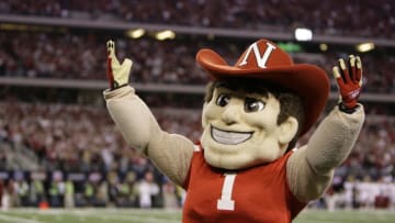 Dec 4, 2010; Arlington, TX, USA; Nebraska Cornhuskers mascot Herbie Husker on the field against the Oklahoma Sooners in the first quarter of the 2010 Big 12 championship game at Cowboys Stadium. Mandatory Credit: Brett Davis-USA TODAY Sports