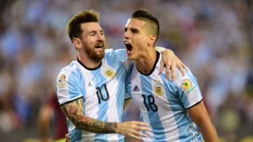 Argentina's Erik Lamela (R) celebrates with teammate Lionel Messi after scoring against Venezuela during a Copa America Centenario quarterfinal football match in Foxborough, Massachusetts, United States, on June 18, 2016. / AFP / ALFREDO ESTRELLA (Photo credit should read ALFREDO ESTRELLA/AFP/Getty Images)