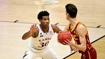 Mar 22, 2021; Indianapolis, Indiana, USA; Kansas Jayhawks guard Ochai Agbaji (30) defends against Southern California Trojans guard Drew Peterson (13) during the first half in the second round of the 2021 NCAA Tournament at Hinkle Fieldhouse. Mandatory Credit: Marc Lebryk-USA TODAY Sports