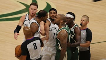MILWAUKEE, WISCONSIN - JUNE 10: Kevin Durant #7 of the Brooklyn Nets and P.J. Tucker #17 of the Milwaukee Bucks exchange words during the second half of Game Three of the Eastern Conference second round playoff series at the Fiserv Forum on June 10, 2021 in Milwaukee, Wisconsin. NOTE TO USER: User expressly acknowledges and agrees that, by downloading and or using this photograph, User is consenting to the terms and conditions of the Getty Images License Agreement. (Photo by Stacy Revere/Getty Images)