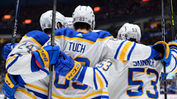 VANCOUVER, CANADA - OCTOBER 22: Alex Tuch #89 of the Buffalo Sabres is congratulated by teammates, Dylan Cozens #24 and Jeff Skinner #53, after scoring a goal against the Vancouver Canucks during their NHL game at Rogers Arena October 22, 2022 in Vancouver, British Columbia, Canada. (Photo by Derek Cain/Getty Images)