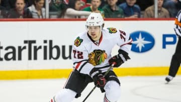 Mar 29, 2016; Saint Paul, MN, USA; Chicago Blackhawks forward Artemi Panarin (72) carries the puck during a game between the Minnesota Wild and Chicago Blackhawks at Xcel Energy Center. The Wild defeated the Blackhawks 4-1. Mandatory Credit: Brace Hemmelgarn-USA TODAY Sports