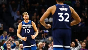 Karl-Anthony Towns of the Minnesota Timberwolves celebrates with Jake Layman. (Photo by David Berding/Getty Images)