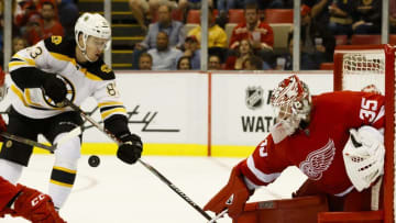 Sep 30, 2016; Detroit, MI, USA; Detroit Red Wings goalie Jimmy Howard (35) makes the save on Boston Bruins left wing Peter Cehlarik (83) in the second period during a preseason hockey game at Joe Louis Arena. Mandatory Credit: Rick Osentoski-USA TODAY Sports