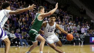 Kansas State Wildcats guard Mark Smith (13) is guarded by Green Bay Phoenix forward Cade Meyer (11) Mandatory Credit: Scott Sewell-USA TODAY Sports