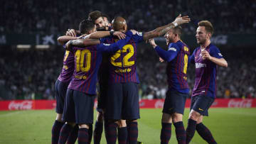 SEVILLE, SPAIN - MARCH 17: Lionel Messi of FC Barcelona celebrates scoring his team's opening goal with team mates during the La Liga match between Real Betis Balompie and FC Barcelona at Estadio Benito Villamarin on March 17, 2019 in Seville, Spain. (Photo by Quality Sport Images/Getty Images)