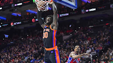 Feb 10, 2023; Philadelphia, Pennsylvania, USA; New York Knicks forward Julius Randle (30) slam dunks past Philadelphia 76ers guard De'Anthony Melton (8) during the second quarter at Wells Fargo Center. Mandatory Credit: Eric Hartline-USA TODAY Sports