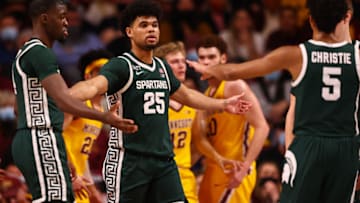 Dec 8, 2021; Minneapolis, Minnesota, USA; Michigan State Spartans forward Malik Hall (25) celebrates with teammates during the second half against the Minnesota Gophers at Williams Arena. Mandatory Credit: Harrison Barden-USA TODAY Sports