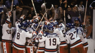 LAKE PLACID, NY - FEB 22: Team USA celebrates their 4-3 victory over the Soviet Union in the semi-final Men's Ice Hockey event at the Winter Olympic Games in Lake Placid, New York on February 22, 1980. The game was dubbed "the Miracle on Ice". The USA went on to win the gold medal by defeating Finland 4-2 in the gold medal game. (Photo by Steve Powell /Getty Images)