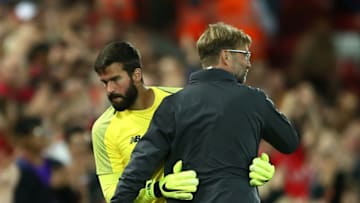 LIVERPOOL, ENGLAND - AUGUST 07: Liverpool manager Jurgen Klopp embraces Alisson Becker of Liverpool during the pre-season friendly match between Liverpool and Torino at Anfield on August 7, 2018 in Liverpool, England. (Photo by Jan Kruger/Getty Images)
