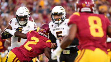 LOS ANGELES, CA - OCTOBER 01: Quarterback Manny Wilkins #5 of the Arizona State Sun Devils scrambles as he is contained by defensive back Adoree' Jackson #2 and defensive back Iman Marshall #8 of the USC Trojans during the first quarter at Los Angeles Coliseum on October 1, 2016 in Los Angeles, California. (Photo by Harry How/Getty Images)