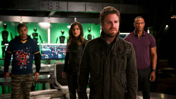 Arrow -- "Present Tense" -- Image Number: AR804a_0139b.jpg -- Pictured (L-R): Rick Gonzalez as Rene Ramirez/Wild Dog, Juliana Harkavy as Dinah Drake/Black Canary, Stephen Amell as Oliver Queen/Green Arrow and David Ramsey as John Diggle/Spartan -- Photo: Jack Rowand/The CW -- © 2019 The CW Network, LLC. All Rights Reserved.
