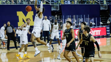 Michigan forward Isaiah Livers (2) celebrates as he dunks against Oakland during the second half at the Crisler Center in Ann Arbor, Sunday, Nov. 29, 2020.