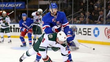 Feb 4, 2016; New York, NY, USA; New York Rangers defenseman Dylan McIlrath (6) hits Minnesota Wild center Ryan Carter (18) during the third period at Madison Square Garden. The Rangers defeated the Wild 4-2. Mandatory Credit: Brad Penner-USA TODAY Sports