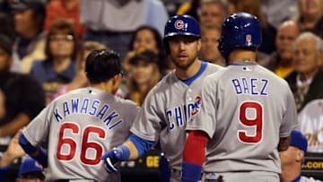 Sep 27, 2016; Pittsburgh, PA, USA; Chicago Cubs second baseman Munenori Kawasaki (66) and left fielder Ben Zobrist (middle) and shortstop Javier Baez (9) celebrate a triple by left fielder Chris Coghlan (not pictured) against the Pittsburgh Pirates during the second inning at PNC Park. Mandatory Credit: Charles LeClaire-USA TODAY Sports