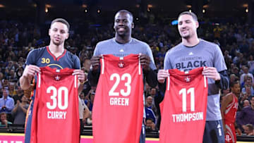 February 9, 2016; Oakland, CA, USA; Golden State Warriors guard Stephen Curry (30), forward Draymond Green (23), and guard Klay Thompson (11) hold their all star jerseys before the game against the Houston Rockets at Oracle Arena. Mandatory Credit: Kyle Terada-USA TODAY Sports