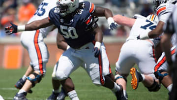 Auburn football defensive lineman Marcus Harris (50) breaks through the line during the A-Day spring practice at Jordan-Hare Stadium in Auburn, Ala., on Saturday, April 9, 2022.