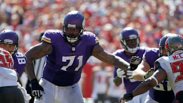 Oct 26, 2014; Tampa, FL, USA; Minnesota Vikings tackle Phil Loadholt (71) blocks against the Tampa Bay Buccaneers during the second half at Raymond James Stadium. Minnesota Vikings defeated the Tampa Bay Buccaneers 19-13. Mandatory Credit: Kim Klement-USA TODAY Sports