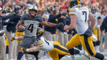 WEST LAFAYETTE, IN - NOVEMBER 03: Rondale Moore #4 of the Purdue Boilermakers runs the ball after a catch as John Milani #18 of the Iowa Hawkeyes tries to make the stop at Ross-Ade Stadium on November 3, 2018 in West Lafayette, Indiana. (Photo by Michael Hickey/Getty Images)