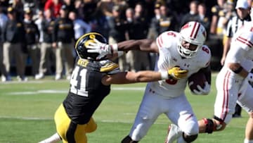 Oct 22, 2016; Iowa City, IA, USA; Wisconsin Badgers running back Corey Clement (6) stiff arms Iowa Hawkeyes linebacker Bo Bower (41) at Kinnick Stadium. The Badgers beat the Hawkeyes 17 to 9. Mandatory Credit: Reese Strickland-USA TODAY Sports