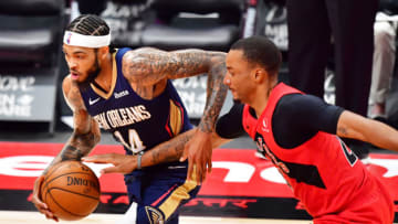 Brandon Ingram #14 of the New Orleans Pelicans dribbles against Norman Powell #24 of the Toronto Raptors (Photo by Julio Aguilar/Getty Images)
