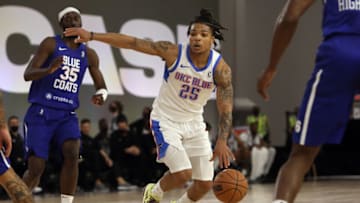 Rob Edwards #25 of the Oklahoma City Blue weaves through the defense of the Delaware Blue Coats during the NBA G League Winter Showcase at the Mandalay Bay Convention Center on December 22, 2021 in Las Vegas, Nevada. NOTE TO USER: User expressly acknowledges and agrees that, by downloading and/or using this photograph, User is consenting to the terms and conditions of the Getty Images License Agreement. (Photo by Joe Buglewicz/Getty Images)