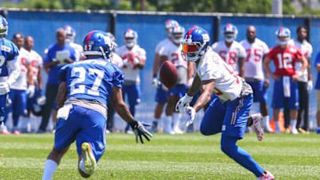 Jun 6, 2016; East Rutherford, NJ, USA; New York Giants safety Darian Thompson (27) intercepts a pass intended for New York Giants wide receiver Odell Beckham (13) during organized team activities at Quest Diagnostics Training Center. Mandatory Credit: Ed Mulholland-USA TODAY Sports