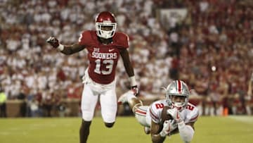 Sep 17, 2016; Norman, OK, USA; Ohio State Buckeyes cornerback Marshon Lattimore (2) dives for but cannot make an interception past Oklahoma Sooners wide receiver A.D. Miller (13) during the second half at Gaylord Family - Oklahoma Memorial Stadium. Mandatory Credit: Kevin Jairaj-USA TODAY Sports