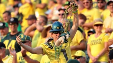 Sep 6, 2014; Eugene, OR, USA; Oregon Ducks fan hold the Michigan State Spartans mascot in the fourth quarter at Autzen Stadium. Mandatory Credit: Scott Olmos-USA TODAY Sports