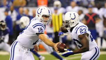 Aug 20, 2016; Indianapolis, IN, USA; Indianapolis Colts quarterback Andrew Luck(12) hands off to running back Frank Gore (23) during the first half against the Baltimore Ravens at Lucas Oil Stadium. Mandatory Credit: Thomas J. Russo-USA TODAY Sports