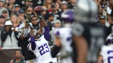OAKLAND, CA - NOVEMBER 15: Cornerback Terence Newman #23 of the Minnesota Vikings intercepts the pass intended for wide receiver Andre Holmes #18 of the Oakland Raiders in the fourth quarter at O.co Coliseum on November 15, 2015 in Oakland, California. (Photo by Thearon W. Henderson/Getty Images)