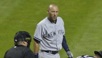 Jul 7, 2014; Cleveland, OH, USA; New York Yankees shortstop Derek Jeter (2) reacts in the rain in the eighth inning against the Cleveland Indians at Progressive Field. Mandatory Credit: David Richard-USA TODAY Sports