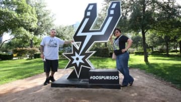 Jun 8, 2014; San Antonio, TX, USA; San Antonio Spurs fans Mike Cavazos (left) and Valerie Guerra pose for a photo prior to the game against the Miami Heat in game two of the 2014 NBA Finals at AT&T Center. Mandatory Credit: Soobum Im-USA TODAY Sports