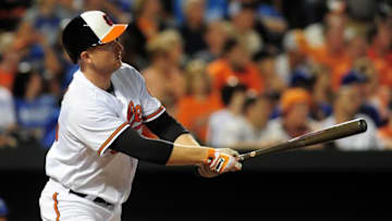 Jun 7, 2016; Baltimore, MD, USA; Baltimore Orioles designated hitter Mark Trumbo (45) hits a home run in the fifth inning against the Kansas City Royals at Oriole Park at Camden Yards. The Orioles won 9-1. Mandatory Credit: Evan Habeeb-USA TODAY Sports