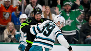 Nov 11, 2022; Dallas, Texas, USA; Dallas Stars left wing Jamie Benn (14) and San Jose Sharks center Logan Couture (39) fight during the second period at American Airlines Center. Mandatory Credit: Jerome Miron-USA TODAY Sports