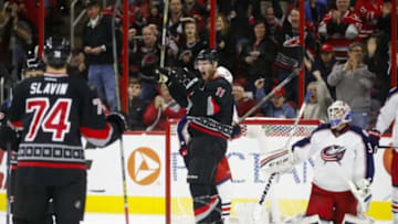 Jan 8, 2016; Raleigh, NC, USA; Carolina Hurricanes forward Jordan Staal (11) celebrates his first period goal against Columbus Blue Jackets goalie Anton Forsberg (31) at PNC Arena. Mandatory Credit: James Guillory-USA TODAY Sports