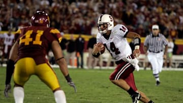 Tavita Pritchard #14 of the Stanford Cardinals carries the ball against the USC Trojans at Memorial Coliseum in Los Angeles, CA. Stanford defeated USC 24-23. (Photo by Charles Baus/Icon SMI/Icon Sport Media via Getty Images)