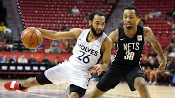 LAS VEGAS, NEVADA - JULY 14: Jordan McLaughlin #26 of the Minnesota Timberwolves drives against Jon Davis #36 of the Brooklyn Nets during a semifinal game of the 2019 NBA Summer League at the Thomas & Mack Center on July 14, 2019 in Las Vegas, Nevada. The Timberwolves defeated the Nets 85-77. NOTE TO USER: User expressly acknowledges and agrees that, by downloading and or using this photograph, User is consenting to the terms and conditions of the Getty Images License Agreement. (Photo by Ethan Miller/Getty Images)
