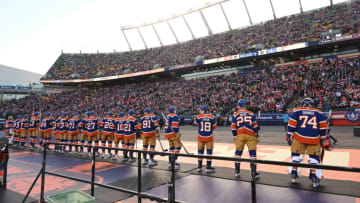 Oct 29, 2023; Edmonton, Alberta, CAN; Edmonton Oilers goalie Stuart Skinner (74) leads the team out before the first period in the 2023 Heritage Classic ice hockey game at Commonwealth Stadium. Mandatory Credit: Walter Tychnowicz-USA TODAY Sports